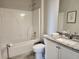 Bathroom showcasing a shower/tub combo, granite countertops, white cabinets, and tile flooring at 1054 Georgian Point Dr, Lawrenceville, GA 30045
