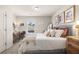 Bright bedroom with stylish decor, including a comfortable bed, chic side tables, and natural light, creating a cozy retreat at 1054 Georgian Point Dr, Lawrenceville, GA 30045