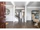 Inviting foyer with dark wood floors, white trim, and an open view of the staircase at 1054 Georgian Point Dr, Lawrenceville, GA 30045