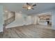 Bright, open living room with vinyl flooring and view into modern eat-in kitchen at 1054 Georgian Point Dr, Lawrenceville, GA 30045