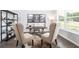 Bright office space with a bookshelf, dark wood desk, and large window at 1054 Georgian Point Dr, Lawrenceville, GA 30045