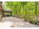 Expansive back deck with scenic views of lush greenery, perfect for outdoor relaxation and entertaining at 221 Streamside Ct, Lilburn, GA 30047
