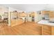 Spacious kitchen with stainless steel appliances, custom cabinets, and hardwood floors at 221 Streamside Ct, Lilburn, GA 30047