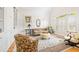 Inviting living room with large windows, plantation shutters, built-in shelving, and comfortable seating at 221 Streamside Ct, Lilburn, GA 30047