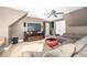 Spacious living room with vaulted ceiling, comfortable seating, entertainment center, and convenient wet bar at 221 Streamside Ct, Lilburn, GA 30047