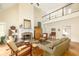 Cozy living room with fireplace, high ceilings and a balcony overlooking the space at 221 Streamside Ct, Lilburn, GA 30047