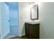 Stylish bathroom with wood-look flooring, new vanity, and a mirror at 3088 Mount Tabor Church Rd, Dallas, GA 30157