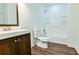 Bright bathroom featuring wood-look flooring, a modern vanity, toilet, and a shower-tub combination at 3088 Mount Tabor Church Rd, Dallas, GA 30157