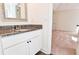 Bathroom features white vanity with granite countertop and view to bedroom at 3088 Mount Tabor Church Rd, Dallas, GA 30157