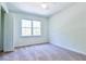 Bright bedroom with a large window and plush carpeting at 3088 Mount Tabor Church Rd, Dallas, GA 30157