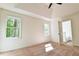Spacious bedroom featuring two large windows and a ceiling fan at 3088 Mount Tabor Church Rd, Dallas, GA 30157
