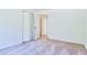 Neutral bedroom featuring a bi-fold closet door and plush carpeting at 3088 Mount Tabor Church Rd, Dallas, GA 30157