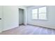 Bedroom with open closet and a large window at 3088 Mount Tabor Church Rd, Dallas, GA 30157