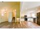 Open-concept kitchen featuring white cabinets, stainless steel appliances, and hardwood flooring at 3088 Mount Tabor Church Rd, Dallas, GA 30157