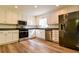 Modern kitchen with white cabinetry, stainless steel appliances, and stylish countertops at 3088 Mount Tabor Church Rd, Dallas, GA 30157