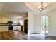 Bright kitchen showcasing white cabinets, stainless steel appliances, and access to an outdoor deck at 3088 Mount Tabor Church Rd, Dallas, GA 30157