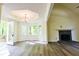 Inviting living room with fireplace, hardwood floors, and access to an outdoor patio at 3088 Mount Tabor Church Rd, Dallas, GA 30157