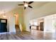 Spacious living area with hardwood floors, stairs to the second floor, and an open view to the kitchen at 3088 Mount Tabor Church Rd, Dallas, GA 30157