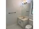 Bathroom featuring a large mirror, vanity with storage, and a toilet at 311 Indus Ln, Lawrenceville, GA 30044