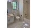 Bathroom featuring a toilet, shower/tub combo, vanity, and marble floors offering a spa-like experience at 311 Indus Ln, Lawrenceville, GA 30044