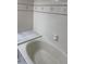 Bathroom featuring a soaking tub with white marble tile, offering a luxurious bathing experience at 311 Indus Ln, Lawrenceville, GA 30044