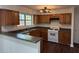 Charming kitchen featuring wood cabinets, granite countertops, and stainless steel appliances at 311 Indus Ln, Lawrenceville, GA 30044