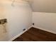 An empty laundry room with laminate flooring at 311 Indus Ln, Lawrenceville, GA 30044