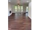 Spacious living room featuring wood floors, a fireplace, and large windows for plenty of natural light at 311 Indus Ln, Lawrenceville, GA 30044