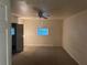 Bedroom featuring neutral walls, a window, a ceiling fan and bi-fold closet doors at 520 Pine Dr, Pine Lake, GA 30072
