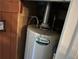 A close-up view of an AO Smith water heater unit, which appears to be in a utility area of the home at 520 Pine Dr, Pine Lake, GA 30072