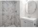 Beautifully remodeled bathroom with a marble-tiled shower and modern fixtures at 5844 Earlwane Dr, Lithonia, GA 30058