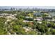 Aerial view of property near the city featuring trees, water, and skyline at 777 Forrest Nw St, Atlanta, GA 30318