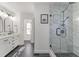 Stylish bathroom featuring black slate flooring, a glass-enclosed shower, and modern vanity at 777 Forrest Nw St, Atlanta, GA 30318