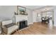 Charming dining area with a decorative fireplace, hardwood floors, and modern lighting at 777 Forrest Nw St, Atlanta, GA 30318