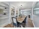 Dining room showcases built-in bookshelves, modern lighting and a view into the living room at 777 Forrest Nw St, Atlanta, GA 30318