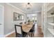 Bright dining room features hardwood floors, built in shelving, and contemporary light fixture at 777 Forrest Nw St, Atlanta, GA 30318