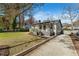 Well-maintained home featuring a cozy front porch, driveway, and a beautifully manicured lawn at 777 Forrest Nw St, Atlanta, GA 30318