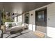 Cozy front porch featuring a swing, welcome mat and gray painted wood finishes at 777 Forrest Nw St, Atlanta, GA 30318