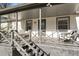 Inviting front porch with a porch swing, seating and stylish gray finishes at 777 Forrest Nw St, Atlanta, GA 30318