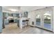 Beautiful eat-in kitchen with breakfast bar, stainless steel appliances, and French doors leading to deck at 777 Forrest Nw St, Atlanta, GA 30318