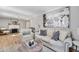 Well-lit living room with hardwood floors, neutral paint, fireplace, and stylish furniture at 777 Forrest Nw St, Atlanta, GA 30318