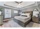 Spacious main bedroom with decorative tray ceiling and hardwood flooring at 777 Forrest Nw St, Atlanta, GA 30318