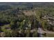 Aerial perspective of the property outlined in black offering seclusion with mature trees on a tree lined street at 175 Stoneview Cir, Covington, GA 30016