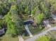 Overhead shot of property showing a house and shed with spacious green lawn and mature trees for added privacy at 175 Stoneview Cir, Covington, GA 30016