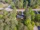 An aerial view of a single-Gathering home, surrounded by lush green trees and a well-maintained lawn at 175 Stoneview Cir, Covington, GA 30016