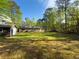 Expansive backyard features a storage shed, providing ample space for recreation and gardening at 175 Stoneview Cir, Covington, GA 30016