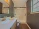 Bathroom featuring dark walls and a modern glass shower at 175 Stoneview Cir, Covington, GA 30016