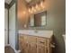 Bathroom vanity with granite countertop, stylish faucet and modern mirror at 175 Stoneview Cir, Covington, GA 30016