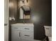 This bathroom features a modern vanity with a stylish, rounded mirror at 175 Stoneview Cir, Covington, GA 30016