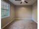 Bedroom with neutral paint, large window offering natural light and plush carpeting at 175 Stoneview Cir, Covington, GA 30016